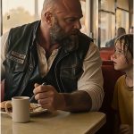 The young man at the counter smiled like he still thought he could walk out.